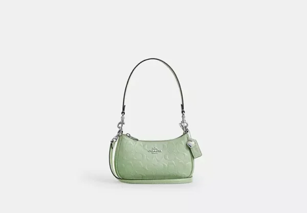 teri mini crossbody bag in signature leather with heart charm